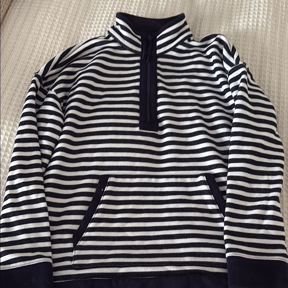 Woman navy and white sweatshirt